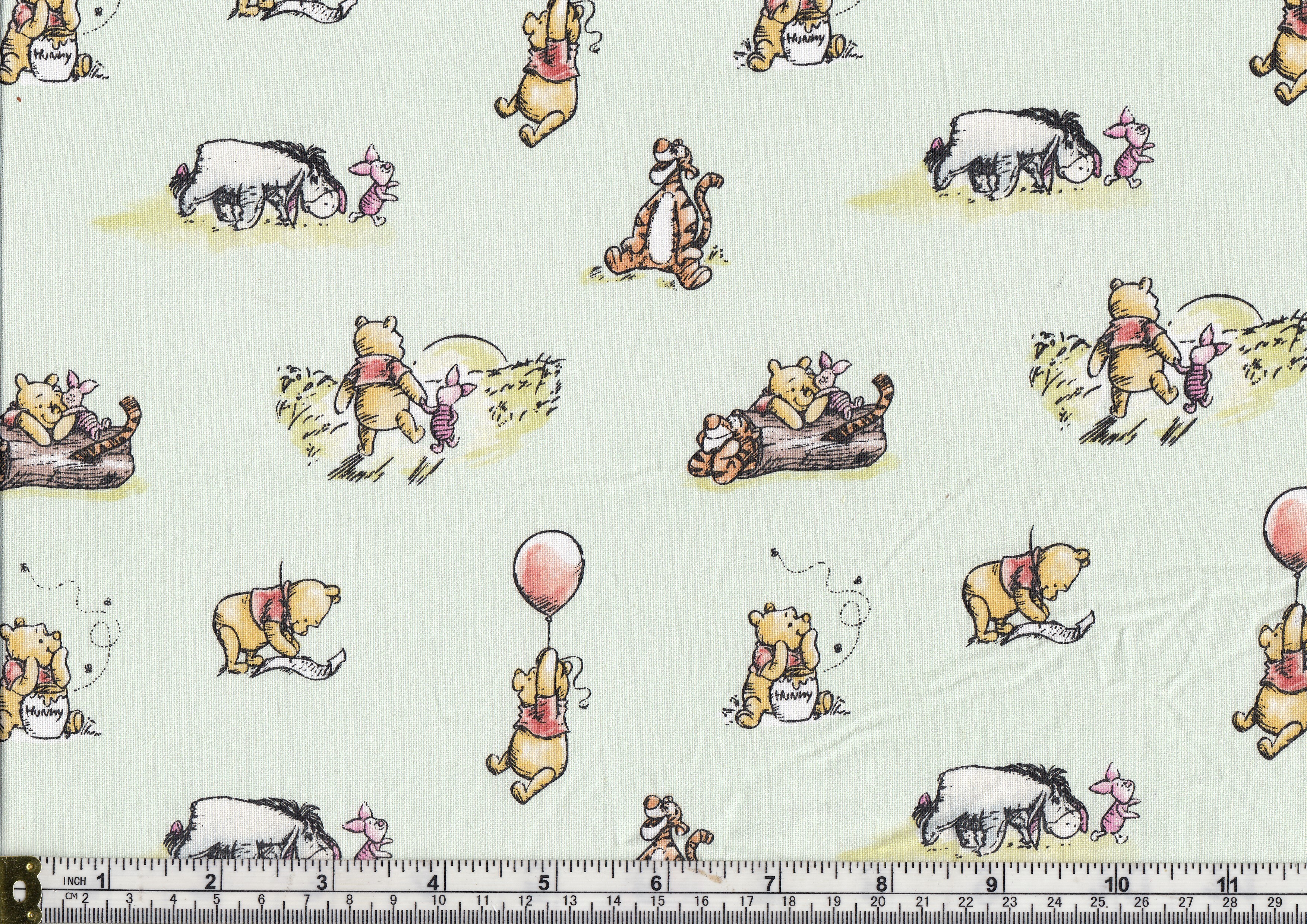 Disney All About Me! Cream Pooh & Friends Faces Fabric - Camelot